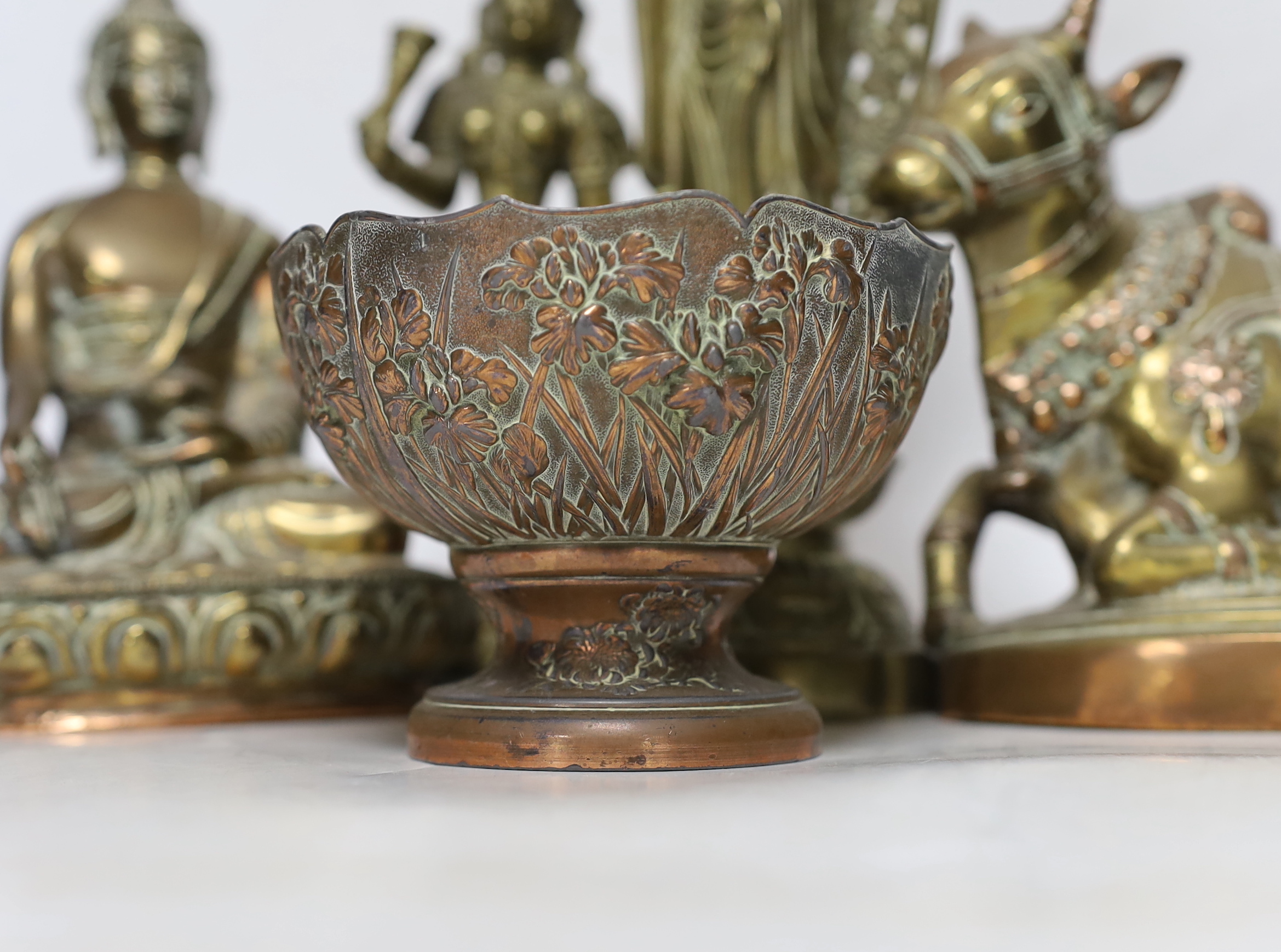 Four bronze deities and a Chinese copper pedestal bowl, tallest 29cm